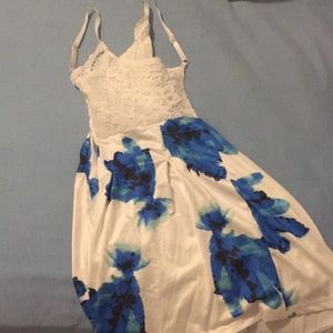 Blue and white romper with flowers and a low back